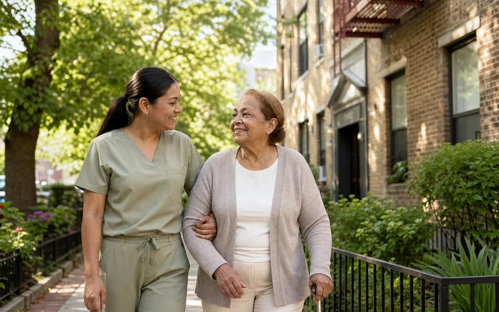 A caregiver supporting an older adult with Parkinson's during a safe walk at home